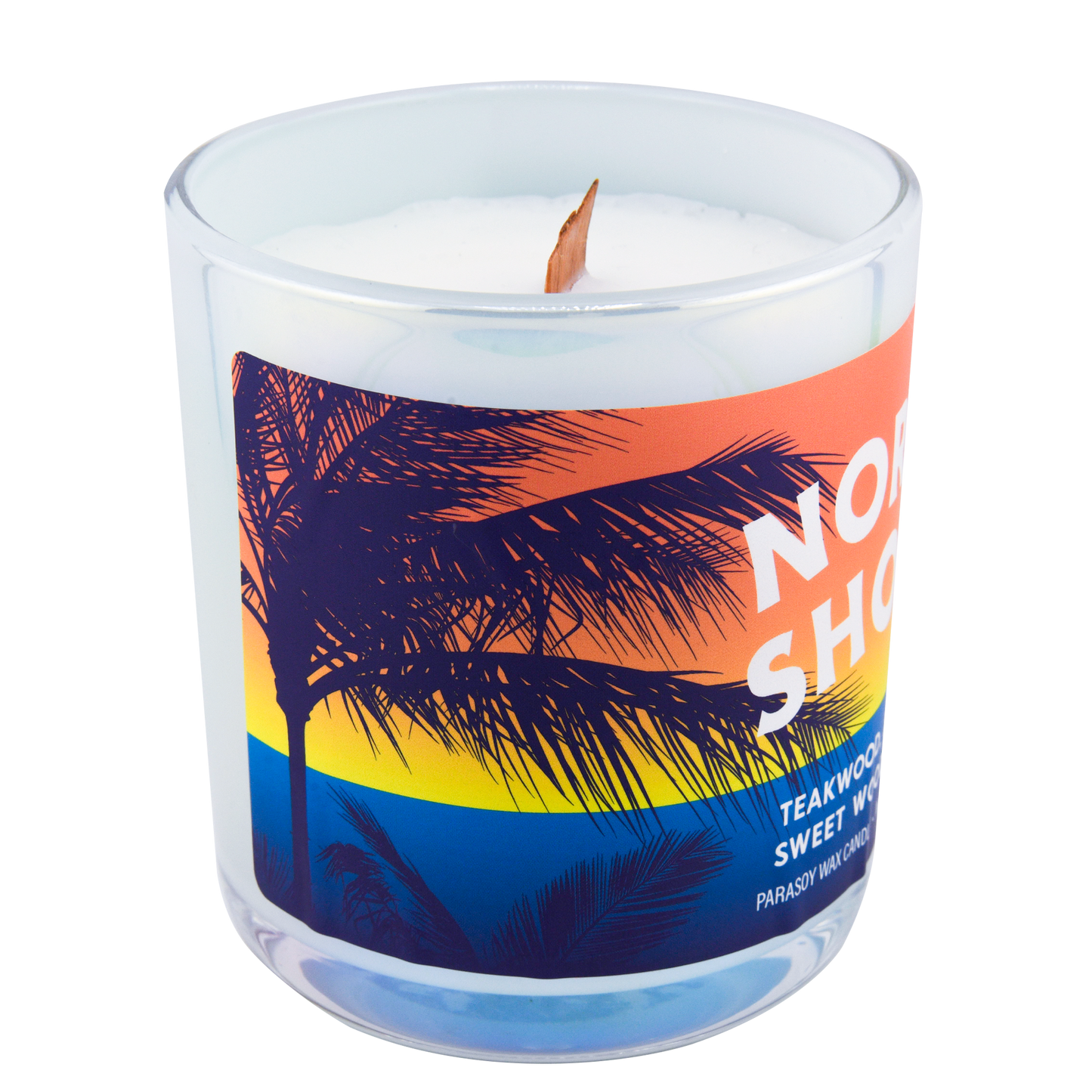 Left-side view of a scented candle in an iridescent jar labeled "North Shore" with notes of teakwood and jasmine.
