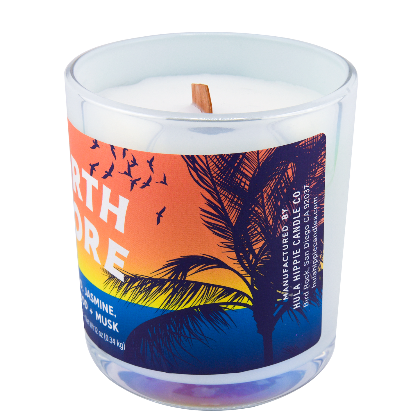 Right-side view of a scented candle in an iridescent jar labeled "North Shore" with notes of teakwood and jasmine.