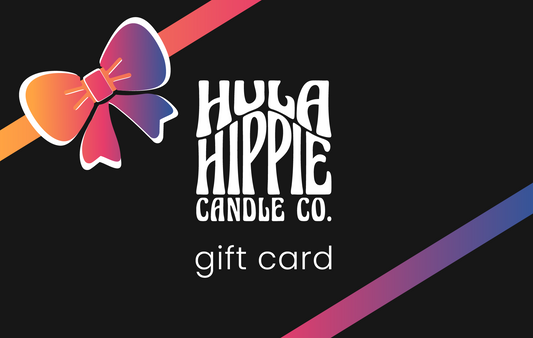 Black gift card with rainbow ribbons and bow. Hula Hippie Logo and text that reads "gift card"