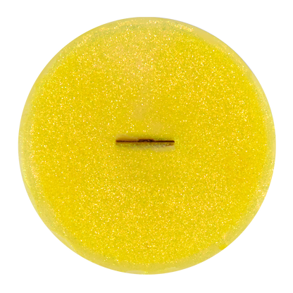 Top view of Grass Skirt wick slip—yellow and glitter refill insert scented with lemon grass essential oil