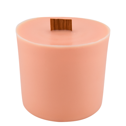 Body view of Poppy wick slip—peach-colored refill insert scented with freesia, marshmallow, and mandarin.
