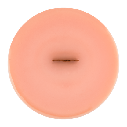 Top view of Poppy wick slip—peach colored refill insert scented with freesia, marshmallow, and mandarin.